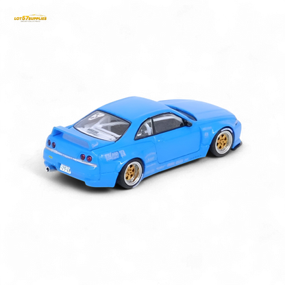 Blue Inno64 Nissan Skyline GT-R R33 diecast model with Pandem Rocket Bunny body kit, detailed miniature car on a white background.