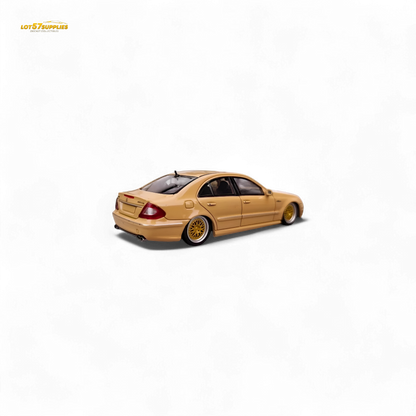 Desert yellow Mercedes-Benz E63 AMG W211 diecast model car in 1:64 scale by Lot57Supplies Diecast Shop, detailed and realistic.