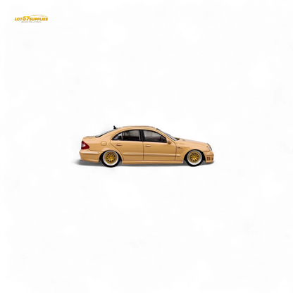 Detailed image of a Desert Yellow 1:64 scale Mercedes-Benz E63 AMG W211 diecast model by Lot57Supplies Diecast Shop.
