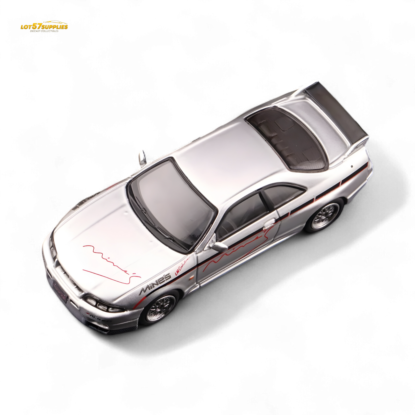 Silver Inno64 Nissan Skyline GT-R R33 diecast car, "Tuned by Mine's," with detailed exterior features in a compact 1:64 scale.