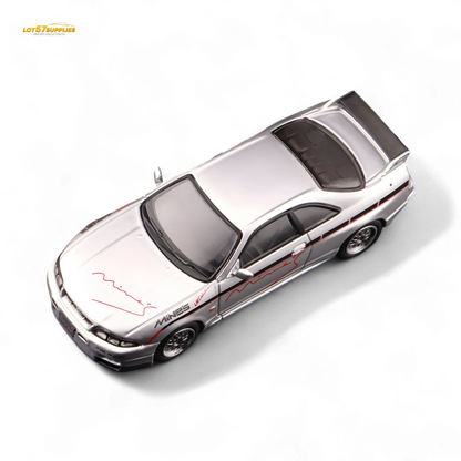 Silver Inno64 Nissan Skyline GT-R R33 diecast car, "Tuned by Mine's," with detailed exterior features in a compact 1:64 scale.