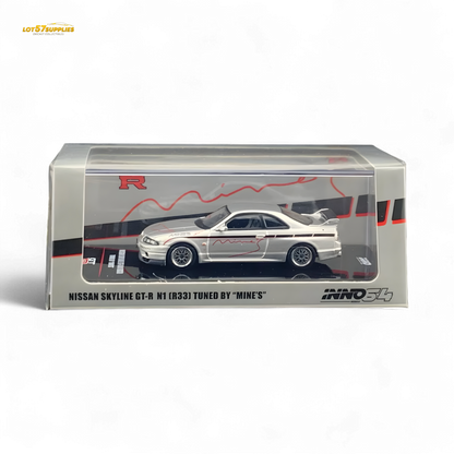 Silver Inno64 Nissan Skyline GT-R R33 diecast car tuned by Mine's, detailed scale model on a neutral background.
