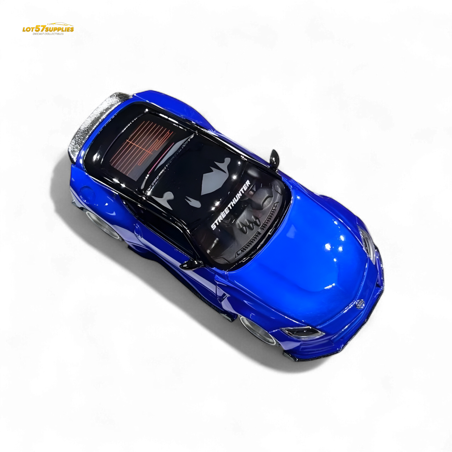 Nissan 400Z Candy Blue 1:64 resin model car, detailed diecast miniature with realistic features and vibrant color.