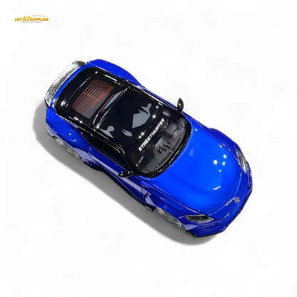 Nissan 400Z Candy Blue 1:64 resin model car, detailed diecast miniature with realistic features and vibrant color.