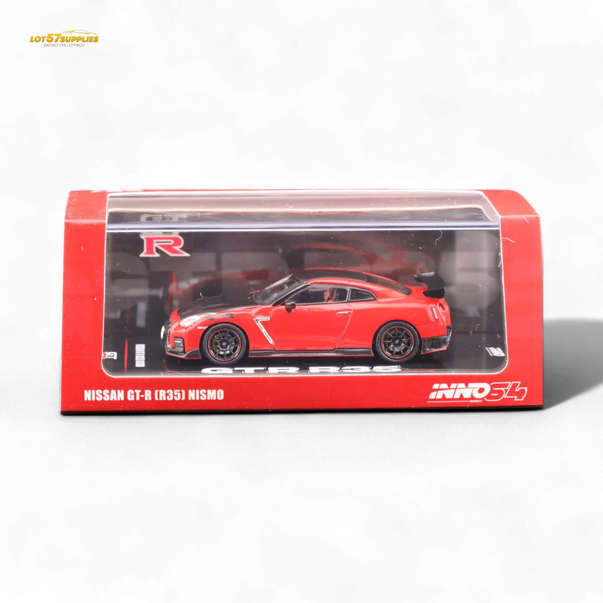 Red Inno64 Nissan GT-R R35 Nismo diecast model car, detailed 1:64 scale replica with realistic features and vibrant finish.