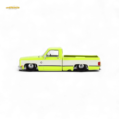 Mini GT x Kaido House Chevrolet Silverado FLO YELLOW diecast truck, 1:64 scale, yellow Chevrolet pickup with detailed design.