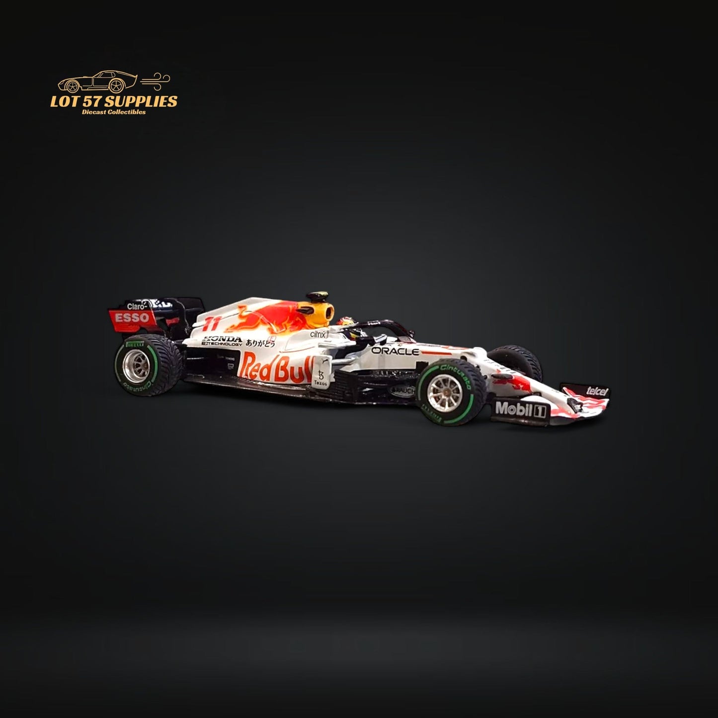Red Bull Mini-GT RB16B #11 Sergio Pérez diecast model in red with detailed racing design, 1:64 scale.