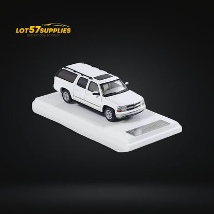 White Chevrolet Suburban miniature diecast model in 1:64 scale by Lot57Supplies Diecast Shop, detailed automotive collectible.
