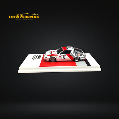 Detailed image of a 1:64 scale Mitsubishi Starion Macau Guia Race 1988 diecast model by Tarmac Works, showcasing race car details.