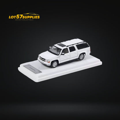 White Chevrolet Suburban diecast model in 1:64 scale by Lot57Supplies Diecast Shop, detailed miniature vehicle.