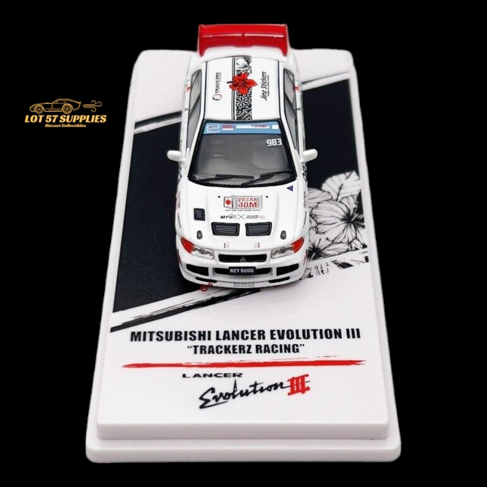 Detailed close-up of a Mitsubishi Lancer Evo III diecast model by Inno64, featuring Trackerz Racing details and realistic design.