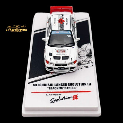 Detailed close-up of a Mitsubishi Lancer Evo III diecast model by Inno64, featuring Trackerz Racing details and realistic design.