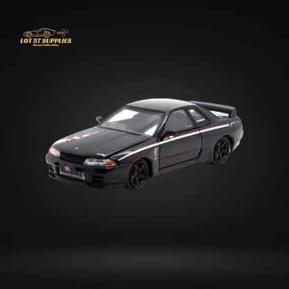Nissan Skyline R32 GT-R Nismo S-Tune diecast model car in 1:64 scale by Lot57Supplies, detailed silver and black exterior.