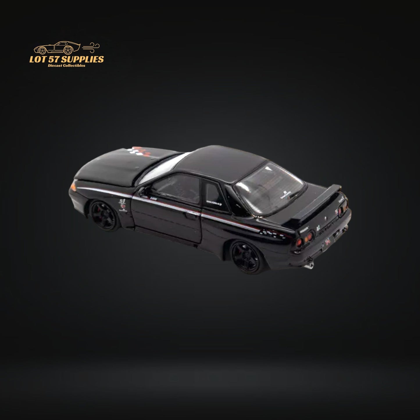 Nissan Skyline R32 GT-R Nismo S-Tune diecast model in 1:64 scale, detailed silver Nissan car with blue accents and racing decals.
