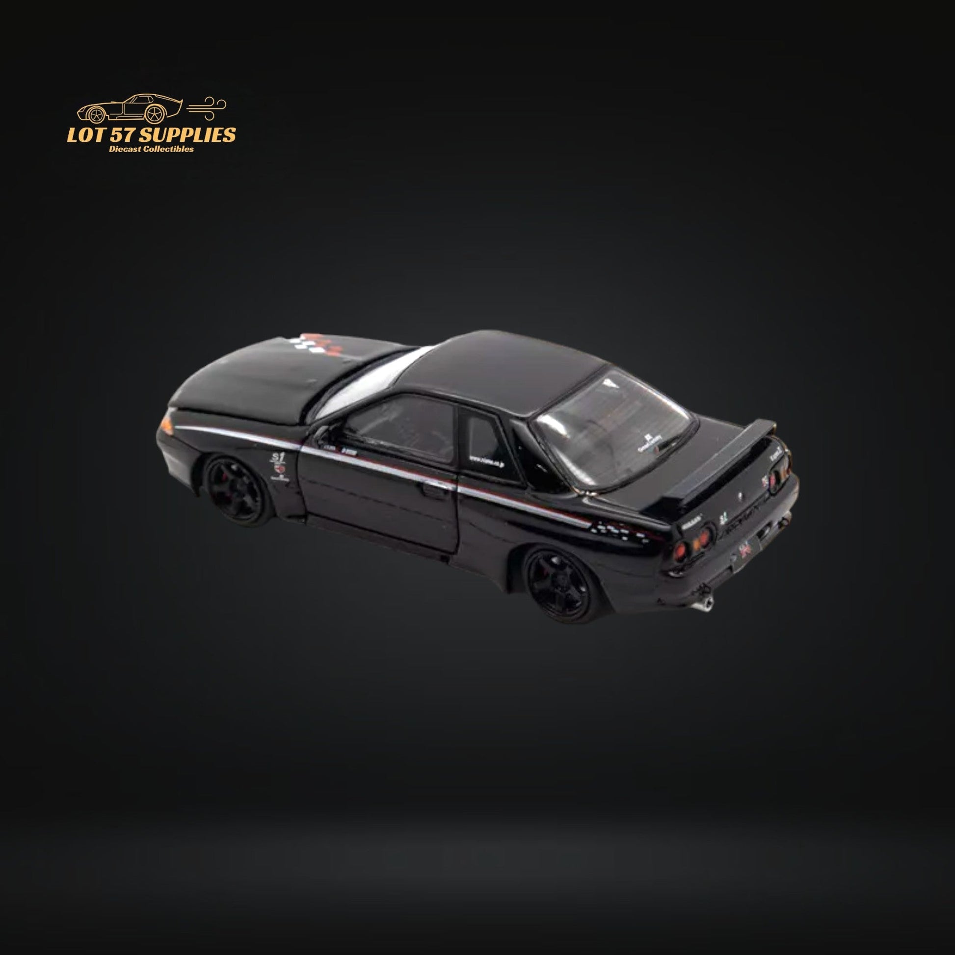 Nissan Skyline R32 GT-R Nismo S-Tune diecast model in 1:64 scale, detailed silver Nissan car with blue accents and racing decals.
