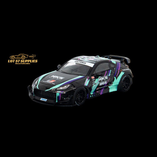 Diecast Toyota GR86 with Rocket Bunny Pandem HKS livery in 1:64 scale, featuring detailed racing car design and vibrant decals.