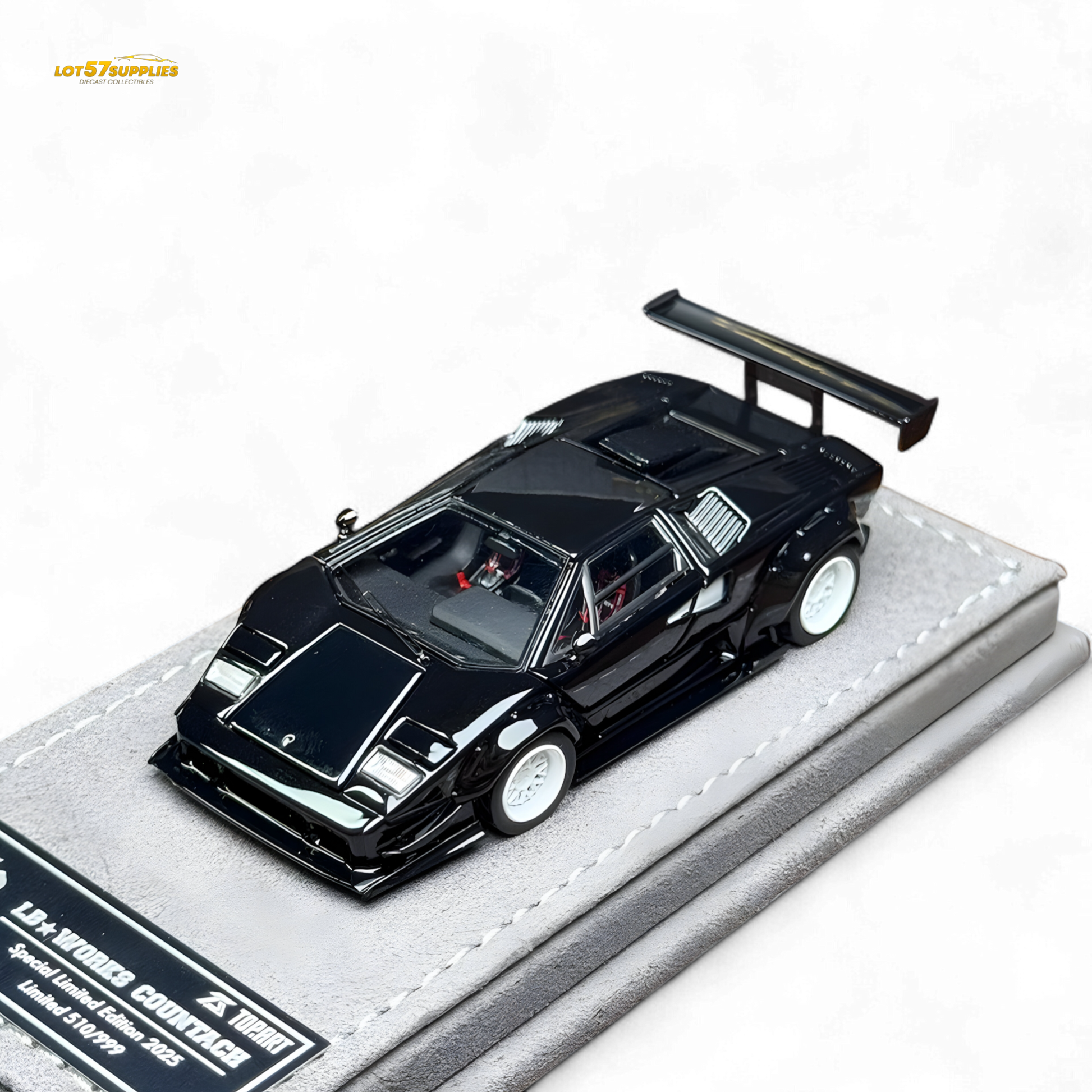 Diecast Lamborghini Countach LBWK with black and white wheels, 1:64 scale model showing detailed exterior design.