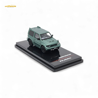 Satin green Inno64 Mitsubishi Pajero Evolution diecast model car, detailed miniature vehicle in 1:64 scale.