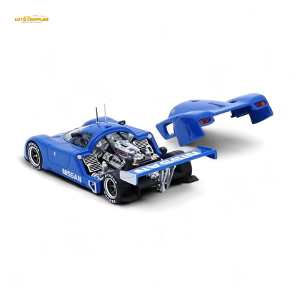 Blue Nissan R89C 1:64 diecast model from Inno64, detailed blue race car with championship livery, displayed on a white background.