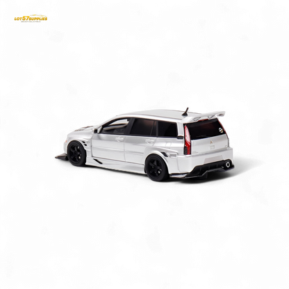 Glossy silver Mitsubishi Lancer EVO 9 Wagon diecast model in 1:64 scale, featuring detailed exterior and realistic design.