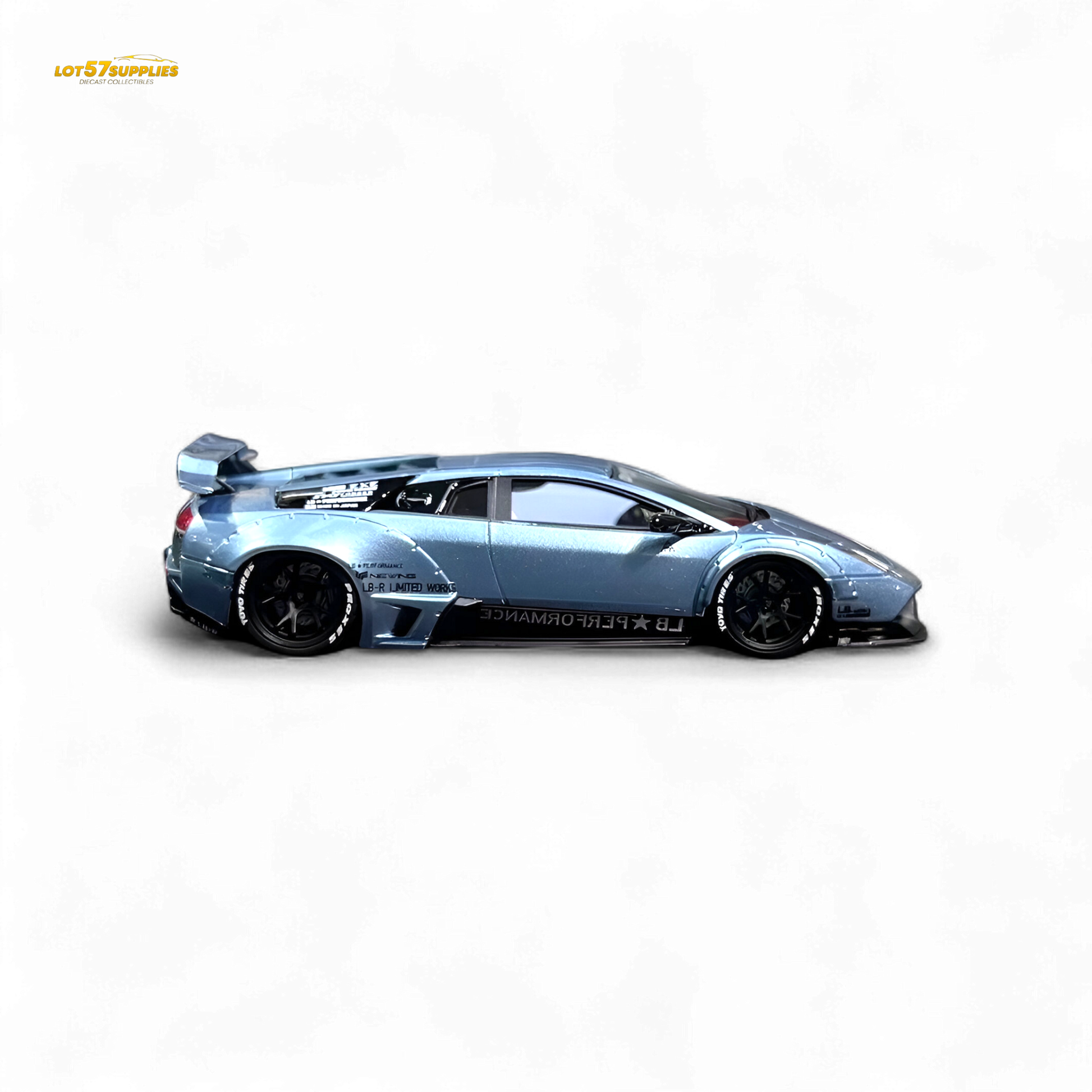 Lamborghini Murcielago LBWK diecast model in ice blue, 1:64 scale, with detailed exterior and Lamborghini branding.