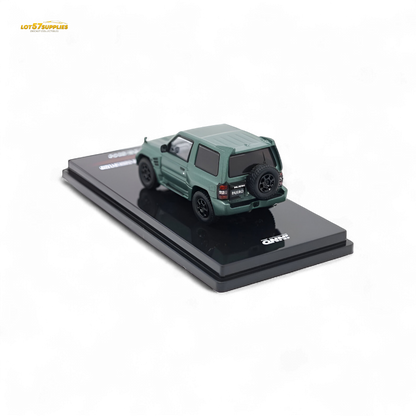 Green Mitsubishi Pajero Evolution diecast model by Inno64, detailed satin finish, 1:64 scale, showcasing its realistic design.