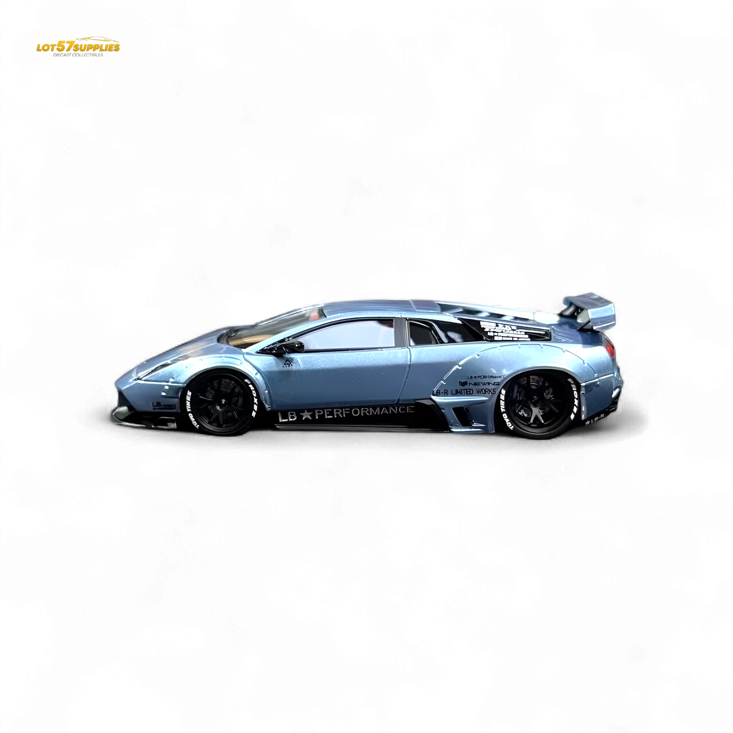 Lamborghini Murcielago LBWK diecast model in ice blue, 1:64 scale, featuring detailed exterior and Lamborghini design.
