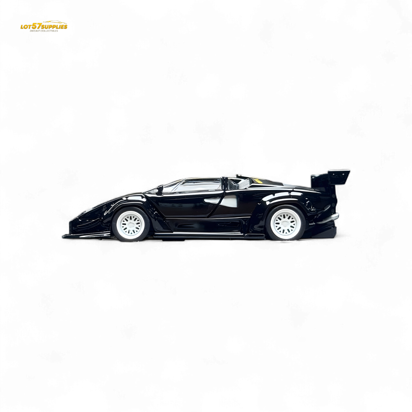 Lamborghini Countach LBWK diecast model with black and white wheels, 1:64 scale, featuring detailed exterior design and vibrant colors.
