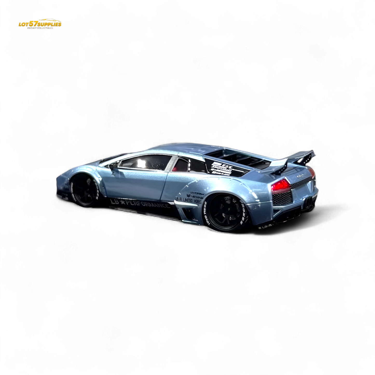 Lamborghini Murcielago LBWK diecast model in ice blue, 1:64 scale, with detailed exterior and Lamborghini branding.