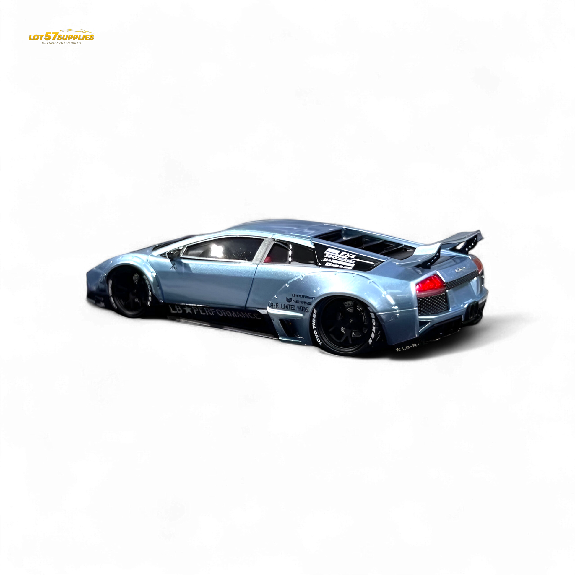Lamborghini Murcielago LBWK diecast model in ice blue, 1:64 scale, with detailed exterior and Lamborghini branding.