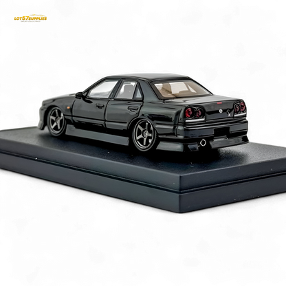 Metallic black Nissan ER34 Skyline Uras diecast model in 1:64 scale, detailed Lot57Supplies Diecast Shop collectible vehicle.