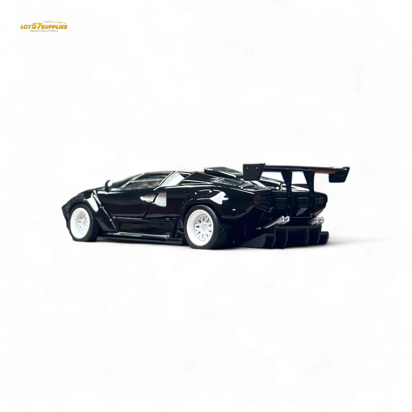 Limited edition 1:64 Lamborghini Countach LBWK diecast model with black and white wheels, detailed and realistic in appearance.