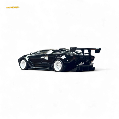 Limited edition 1:64 Lamborghini Countach LBWK diecast model with black and white wheels, detailed and realistic in appearance.