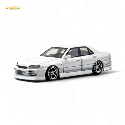 Pearl white Nissan ER34 Skyline Uras diecast model car in 1:64 scale, detailed miniature from Lot57Supplies Diecast Shop.
