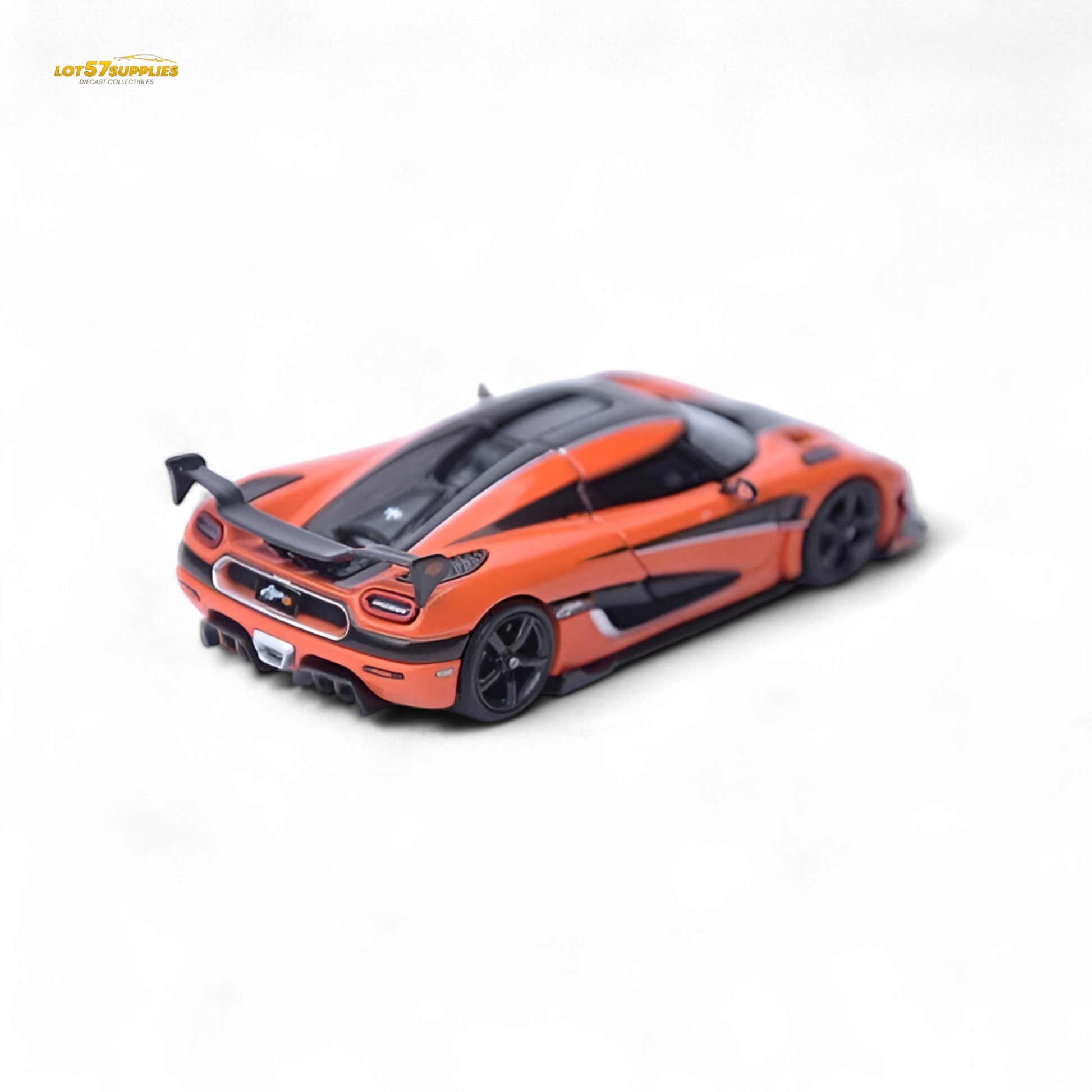 Orange Focal Horizon Agera RS Pagani diecast model in 1:64 scale, detailed miniature car with visible features and branding.