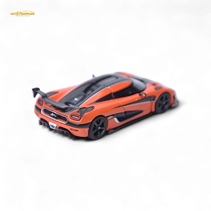 Orange Focal Horizon Agera RS Pagani diecast model in 1:64 scale, detailed miniature car with visible features and branding.