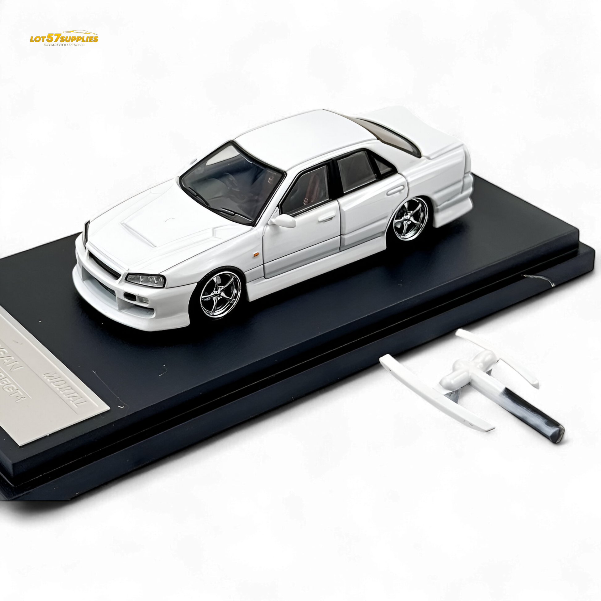 Pearl white Nissan ER34 Skyline diecast model car by Lot57Supplies, 1:64 scale, detailed Nissan sports car replica.