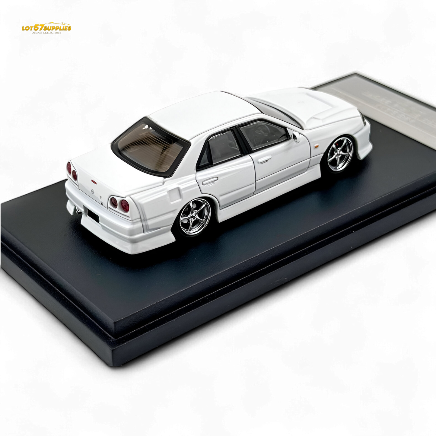 Pearl white Nissan ER34 Skyline diecast model car in 1:64 scale by Lot57Supplies Diecast Shop, detailed miniature collectible.