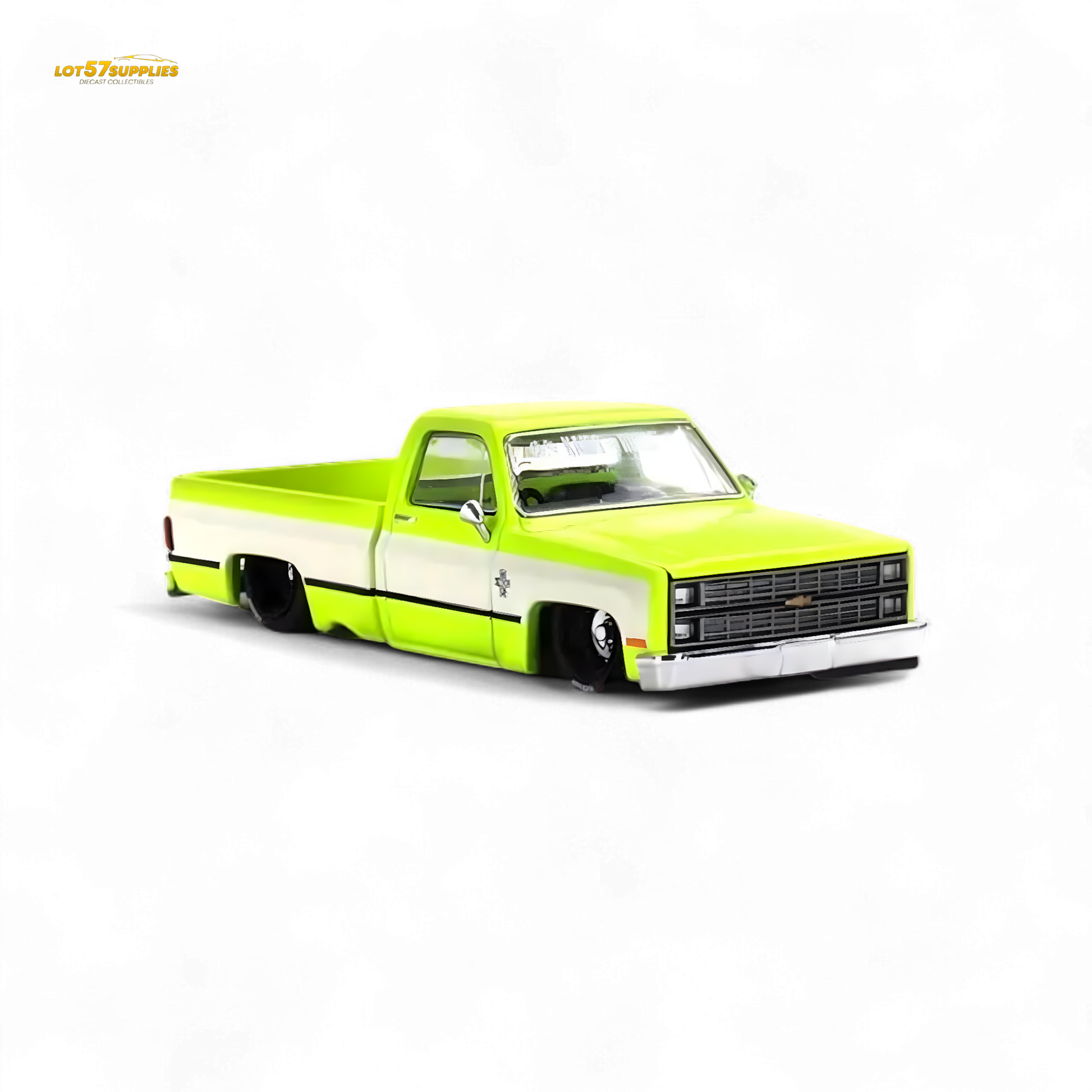Mini GT x Kaido House Chevrolet Silverado diecast truck in yellow, 1:64 scale, featuring detailed design and vibrant color.