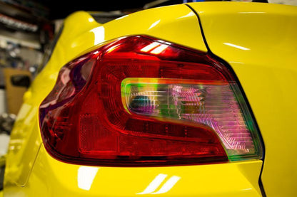 Dark smoked tail light overlays for 2015-2020 Subaru WRX STI, with light, red, or yellow tint, by StickerFab.