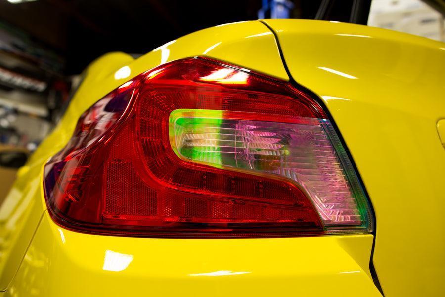Smoked tail light overlays for 2015-2020 Subaru WRX STI, featuring dark, light, red, or yellow tint options by StickerFab.