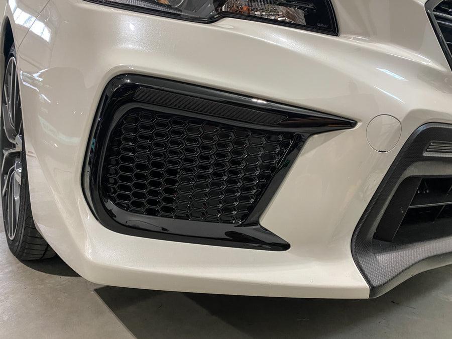Dark smoke carbon fiber JDM DRL bezel overlays for 2018-2021 Subaru WRX/STI fog lights, by StickerFab.