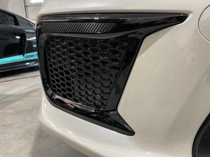 Dark smoke carbon fiber JDM DRL bezel overlays for 2018-2021 Subaru WRX/STI, designed as fog/DRL accents by StickerFab.