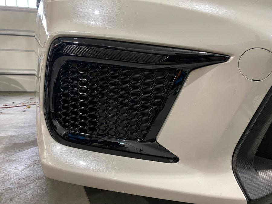 Dark smoke carbon fiber JDM DRL bezel overlays for 2018-2021 Subaru WRX/STI fog lights, by StickerFab.