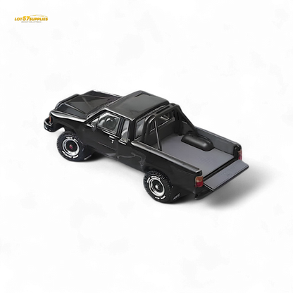 Black Toyota Hilux SR5 diecast model in 1:64 scale by Lot57Supplies Diecast Shop, detailed miniature vehicle with realistic features.