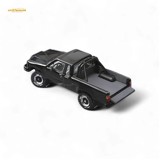 Black Toyota Hilux SR5 diecast model in 1:64 scale by Lot57Supplies Diecast Shop, detailed miniature vehicle with realistic features.