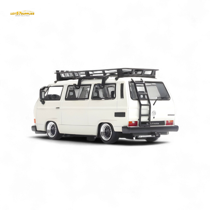 White Volkswagen T3 Lowrider diecast model in 1:64 scale by Lot57Supplies Diecast Shop, detailed view of the miniature vehicle.