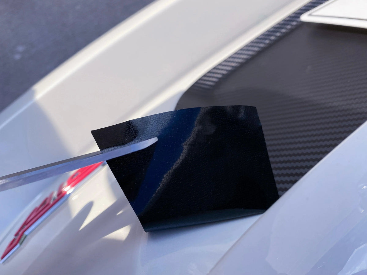 Black 3D carbon fiber license plate panel overlay for 2015-2020 Subaru WRX and STI by StickerFab, exterior body accessory.