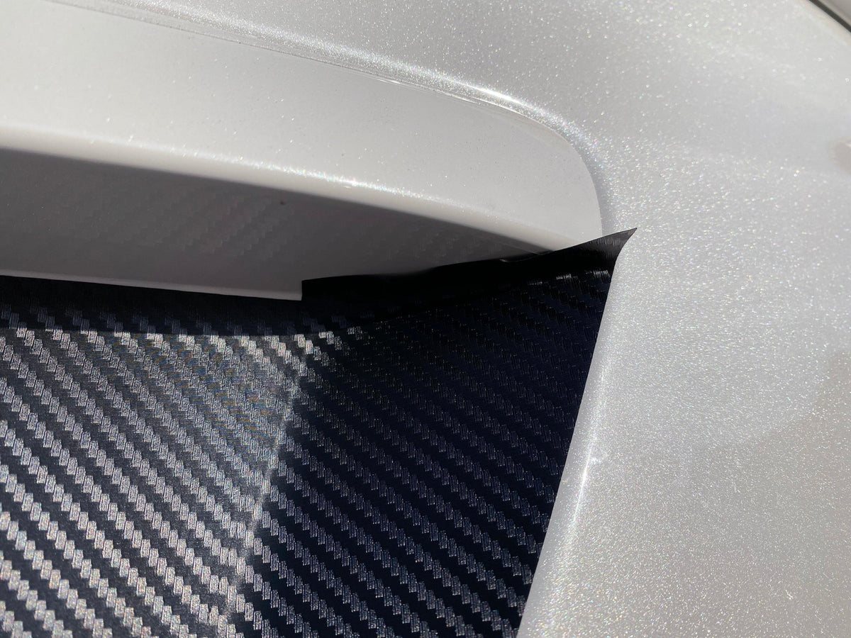 Black 3D carbon fiber license plate panel overlay for 2015-2020 Subaru WRX and STI from StickerFab, exterior body accessory.