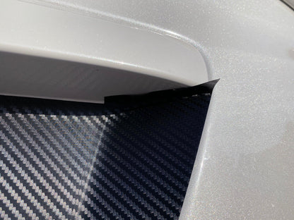 Black 3D carbon fiber license plate panel overlay for 2015-2020 Subaru WRX and STI from StickerFab, exterior body accessory.